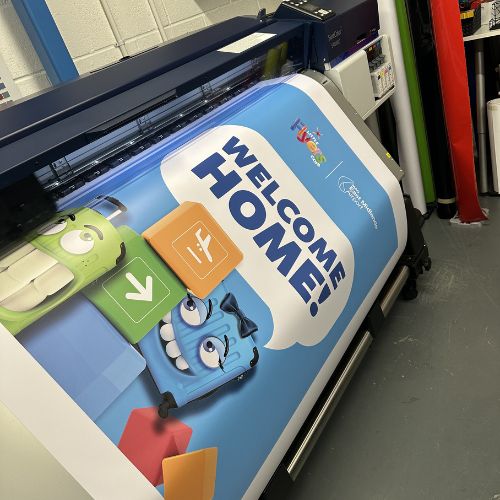 Large format print for East Midlands Airport coming off the printer