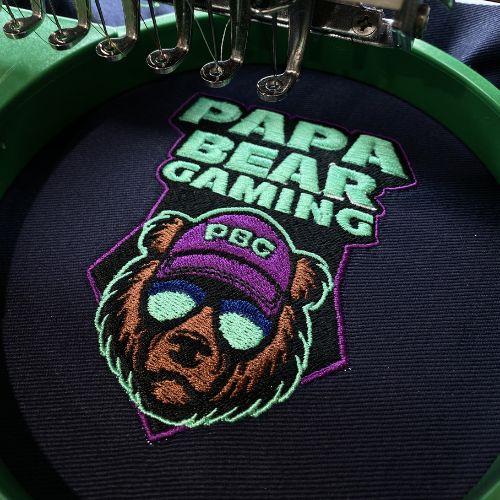 Embroidered Papa Bear Gaming logo on a garment
